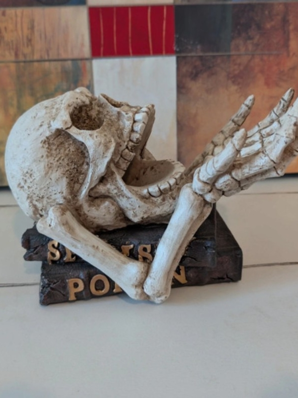 Skull and Hands Decorative Bottle Sculpture on Stacked Books Halloween Gothic